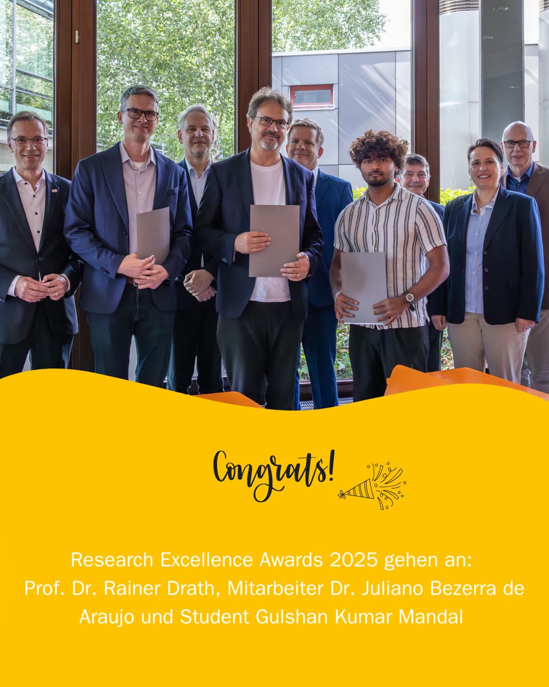 A group portrait above a yellow graphic announcing the Research Excellence Awards 2025.